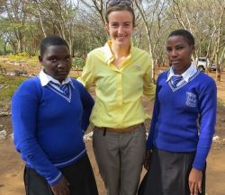 Cassi with sponsored students Albina Alphonce and Jewels Philbert      