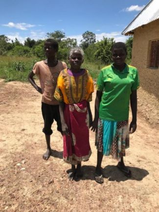 Bibiana_with_her_family_outside_their_home