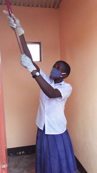 Nyaishozi Secondary schoolgirl gloved and masked