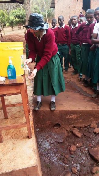 Wash station in use at Ruhinda School